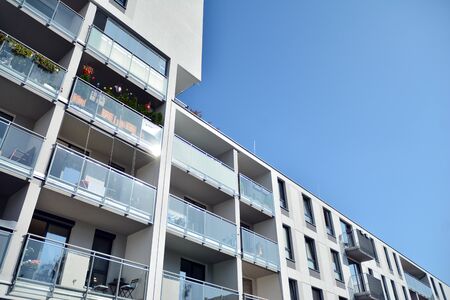 Modern luxury urban apartment building exterior with blue sky