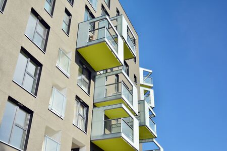 Modern apartment buildings on a sunny day with a blue sky. Facade of a modern apartment building