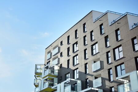 Modern apartment buildings on a sunny day with a blue sky. Facade of a modern apartment building