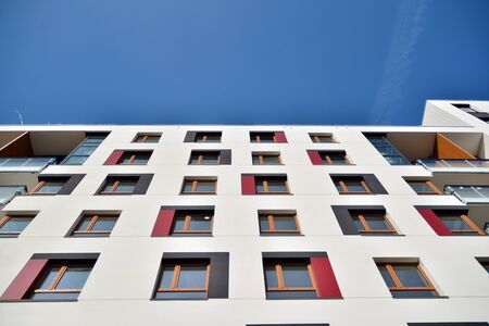 Modern apartment buildings on a sunny day with a blue sky. Facade of a modern apartment building