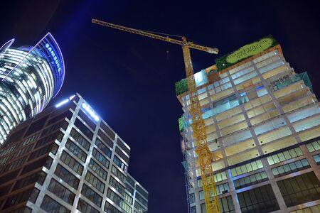 Warsaw, Poland. November 8, 2019. Construction site of an Generation Park office building at night.のeditorial素材