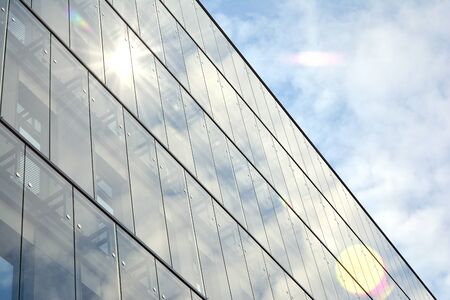 Sky reflected in a modern building glass facade