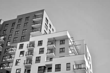Detail of modern residential flat apartment building exterior. Fragment of new luxury house and home...