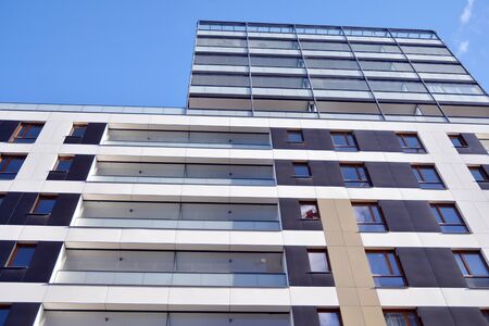 Fragment of modern residential apartment with flat buildings exterior. Detail of new luxury house...
