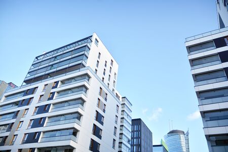 Fragment of modern residential apartment with flat buildings exterior. Detail of new luxury house...