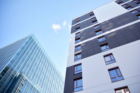 Fragment of modern residential apartment with flat buildings exterior. Detail of new luxury house...