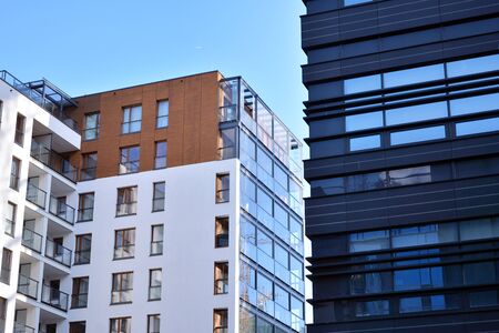 Fragment of modern residential apartment with flat buildings exterior. Detail of new luxury house...