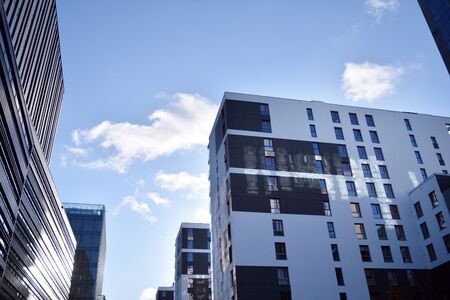 Fragment of modern residential apartment with flat buildings exterior. Detail of new luxury house...