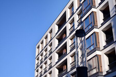 Modern and new apartment building. Multistoried modern, new and stylish living block of flats.