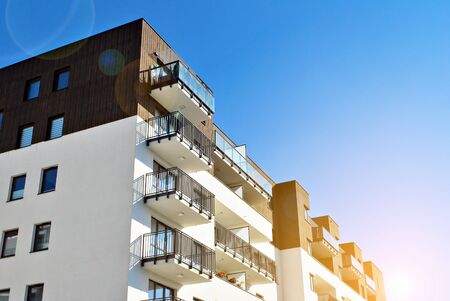 Sun rays light effects on urban buildings. Fragment of modern residential apartment with flat...