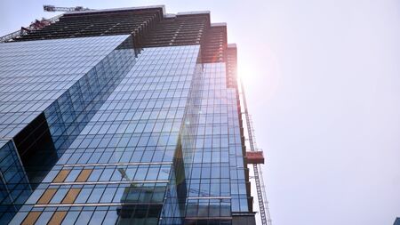 Building under construction at sunset.