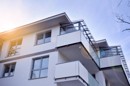 Contemporary residential building exterior in the daylight. Modern apartment buildings on a sunny...