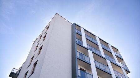 Contemporary residential building exterior in the daylight. Modern apartment buildings on a sunny...