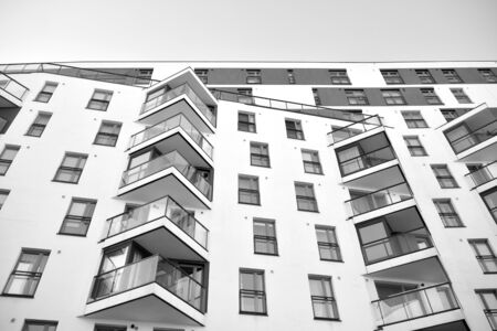 Detail of modern residential flat apartment building exterior. Fragment of new luxury house and home...