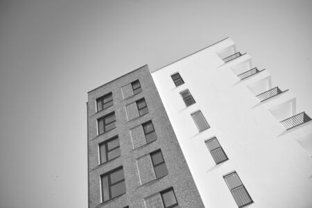 Detail of modern residential flat apartment building exterior. Fragment of new luxury house and home...