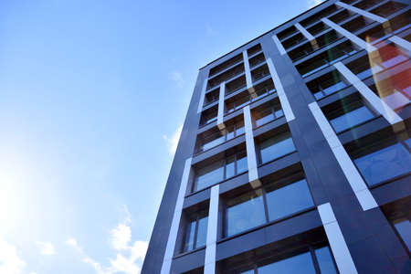 Modern office building facade abstract fragment, shiny windows in steel structure
