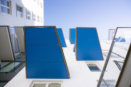 Exterior of new apartment buildings on a blue cloudy sky background. No people. Real estate business...
