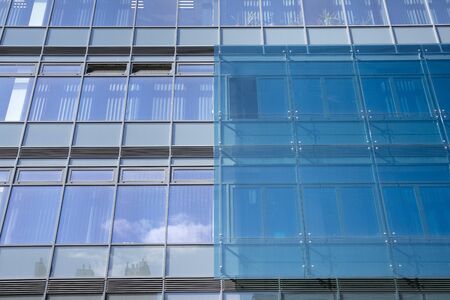 Abstract texture and blue glass facade in modern office building.