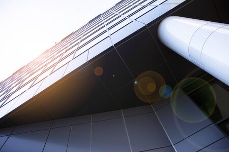 Abstract reflection of modern city glass facades. Modern office building detail, glass surface.