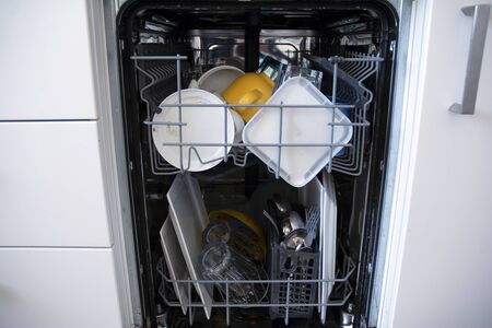 A full dishwasher - ready to go. It is all loaded up with dirty dishes.