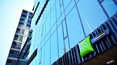 Warsaw, Poland. 19 April 2020. Sign Ibis Styles Hotels. Company signboard Ibis Styles Hotels.