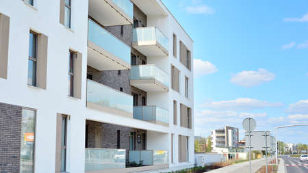 Warsaw, Poland. 21 April 2020. Modern apartment building in Bemowo district on a sunny day with a...
