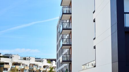 Modern condo building with big windows and modern facade.