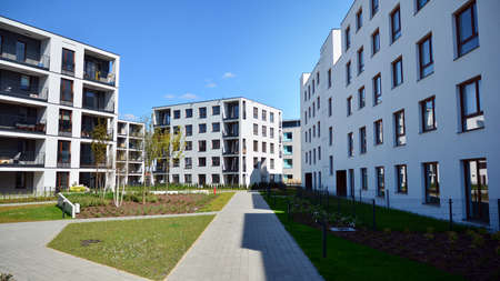 Warsaw, Poland. 27 April 2020. Modern apartment building in Wilanow district on a sunny day with a...