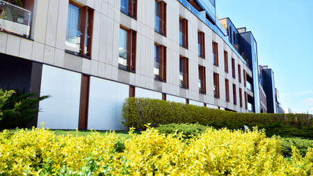Warsaw, Poland. 27 April 2020. Modern apartment building in Wilanow district on a sunny day with a...