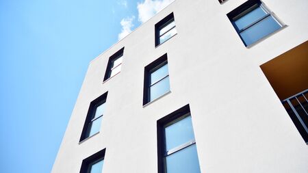 Contemporary residential building exterior in the daylight. Modern apartment buildings on a sunny...