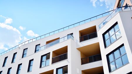 Contemporary residential building exterior in the daylight. Modern apartment buildings on a sunny...