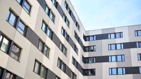 Modern condo building with big windows and modern facade.