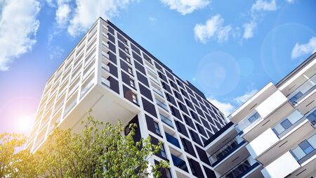 Modern apartment buildings on a sunny day with a blue sky. Facade of a modern apartment building....