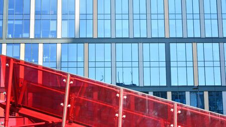 Modern Architecture. Glass facade on the blue sky. Corporate concept - detail of modern glass...