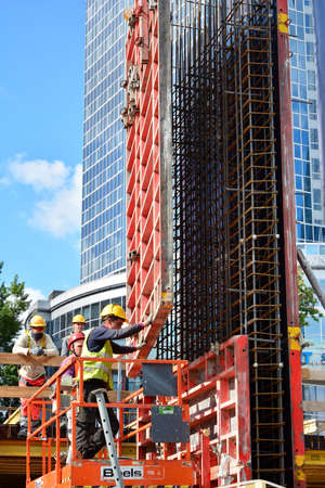 Warsaw, Poland. 26 May 2020. Office building Skysawa under construction. Builder workers knitting...