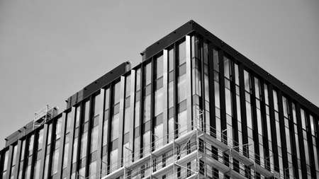 Abstract modern architecture with high contrast black and white tone. Architecture of geometry at glass window - monochrome.のeditorial素材