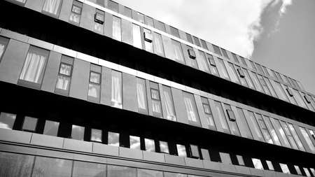 Abstract modern architecture with high contrast black and white tone. Architecture of geometry at glass window - monochrome.のeditorial素材