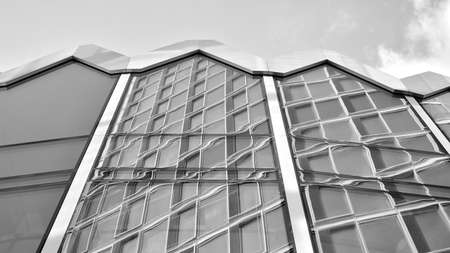 Abstract modern architecture with high contrast black and white tone. Architecture of geometry at glass window - monochrome.のeditorial素材
