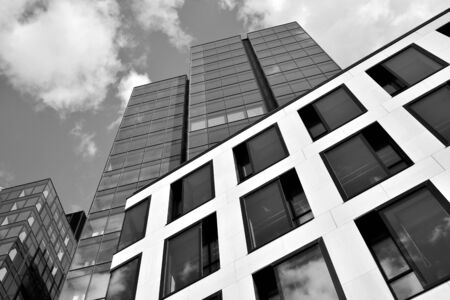Urban geometry, looking up to glass building. Modern architecture, glass and steel. Abstract modern...