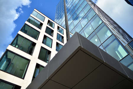 Facade texture of a glass mirrored office building. Fragment of the facade. Modern architecture of...