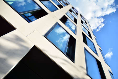 Facade texture of a glass mirrored office building. Fragment of the facade. Modern architecture of...