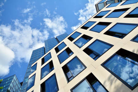 Facade texture of a glass mirrored office building. Fragment of the facade. Modern architecture of the office building.のeditorial素材