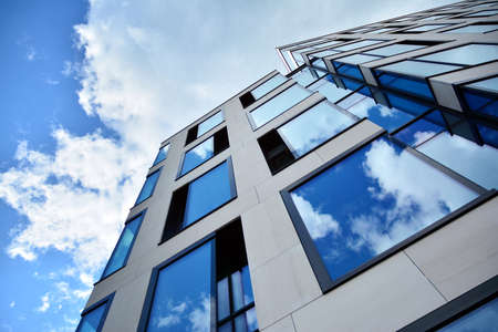 Facade texture of a glass mirrored office building. Fragment of the facade. Modern architecture of...
