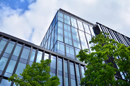 Facade texture of a glass mirrored office building. Fragment of the facade. Modern architecture of...