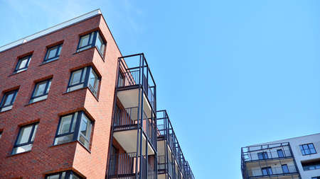 Contemporary residential building exterior in the daylight. Modern and new apartment building....