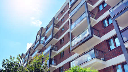 Contemporary residential building exterior in the daylight. Modern and new apartment building....