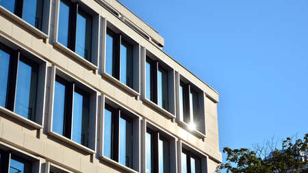 Facade texture of a glass mirrored office building. Fragment of the facade. Modern architecture of...