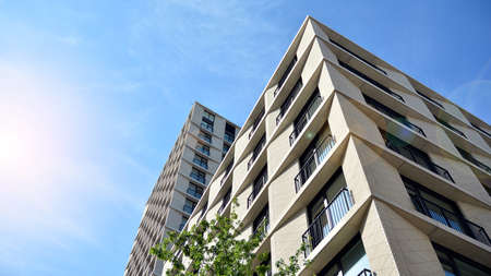 New housing landscape. Facade of a new multi-story residential building.