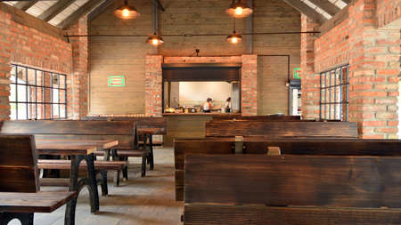 Vintage of ceiling lamps in the building. Wooden roof in the background.