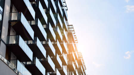 Architectural details of modern apartment building. Modern european residential apartment building complex. Sunset.の写真素材